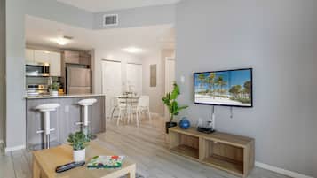 Comfort Condo, 2 Bedrooms | Living area | 50-inch Smart TV with cable channels