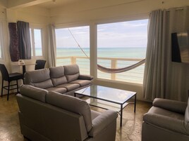 Luxury Penthouse, Beach View | Living area | 42-inch LED TV with cable channels