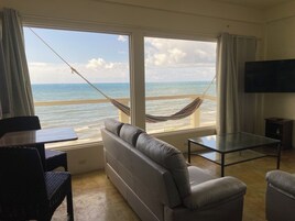 Luxury Penthouse, Beach View | Living area | 42-inch LED TV with cable channels