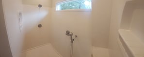 Shower, towels, soap, toilet paper