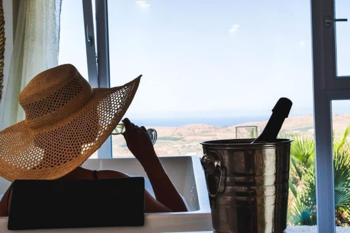 Luxury Room, Hot Tub, Partial Sea View | Pillowtop beds, in-room safe, soundproofing, iron/ironing board