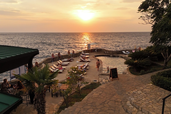 Seasonal outdoor pool, pool umbrellas, pool loungers