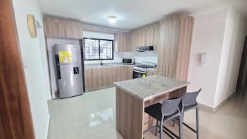 Luxury Apartment, Garden View | Private kitchen | Oven, cookware/dishes/utensils