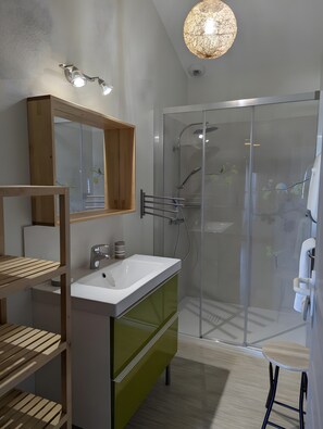 A modern bathroom with a glass shower enclosure, a wooden vanity, and a large mirror. - Holiday Home 'La Bonne Chauffe - Serpentin' with Shared Pool, Private Terrace and Wi-Fi (Verrières)