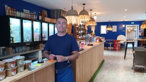 A bar area with a counter, shelves with bottles, and hanging lights. - Le Petit Marais – Relaxation for Families with Jacuzzi, Garden, and Air Conditioning (Échiré)