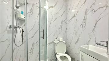 Shower, hair dryer, towels, soap