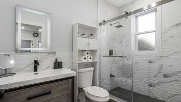 Shower, hair dryer, towels, soap