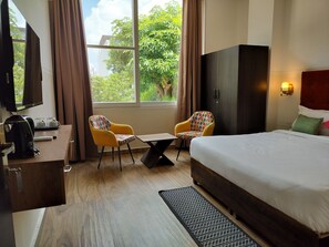Premium Room | Desk, laptop workspace, soundproofing, free WiFi - Saffron Inn  (Greater Noida)