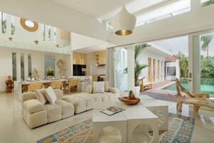 Villa, Pool View | Living area | 42-inch flat-screen TV with digital channels