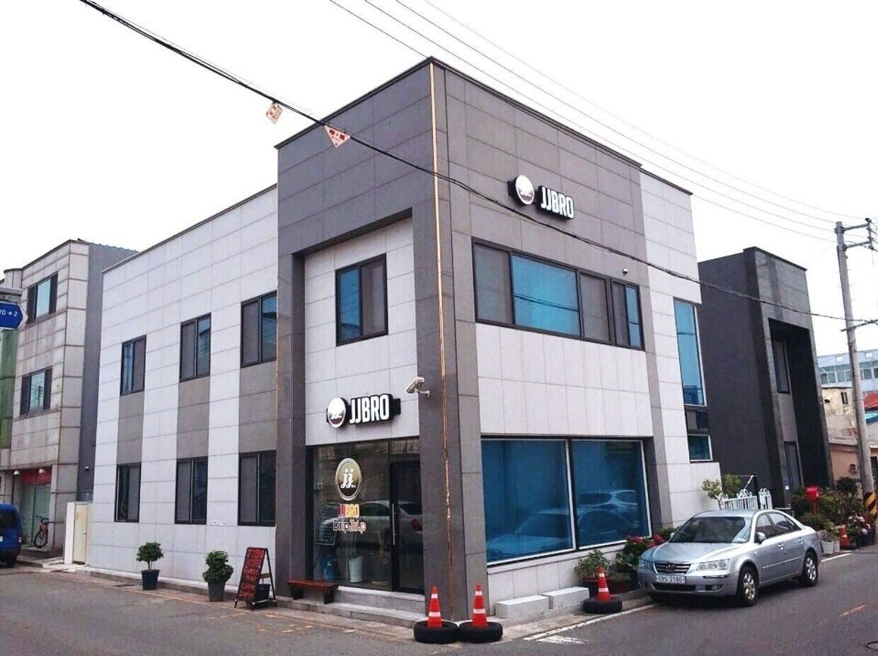 A modern building with a storefront labeled "JIBRO".