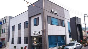 A modern building with a storefront labeled "JIBRO".