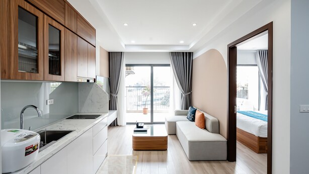 A modern apartment with a kitchen, a living area, and a bedroom. - FLESTA Nui Truc Serviced Apartment & Hotel (Hanoi)