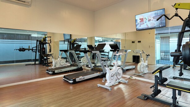 A gym with treadmills, stationary bikes, and weight machines. - SOLTERRA SEMINYAK Boutique Hotel & Spa Powered By Archipelago (Keroboken Kelod)