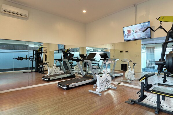 A gym with treadmills, stationary bikes, and weight machines. - SOLTERRA SEMINYAK Boutique Hotel & Spa Powered By Archipelago (Keroboken Kelod)