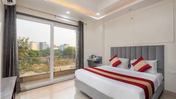 Desk, laptop workspace, blackout drapes, iron/ironing board