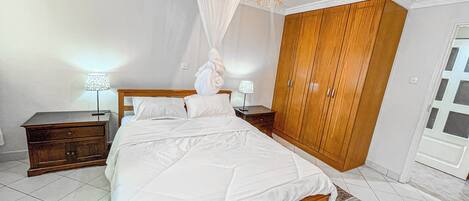 Desk, laptop workspace, blackout drapes, iron/ironing board