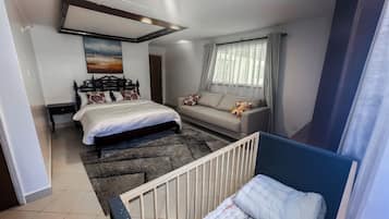 Deluxe Villa, Garden View | Desk, laptop workspace, blackout drapes, iron/ironing board