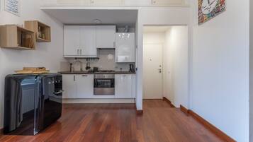 Apartment, Balcony, City View | Private kitchen | Fridge, oven, stovetop, dishwasher