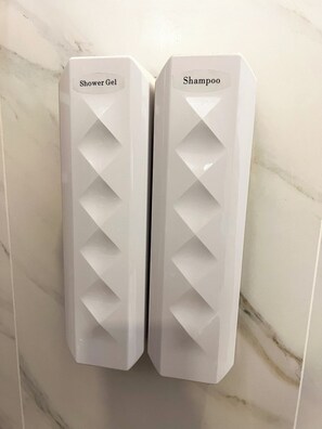Hair dryer, towels, soap, toilet paper