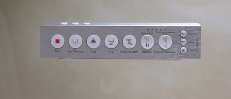 A control panel with various massage settings including options for water temperature, pressure, and different massage techniques.