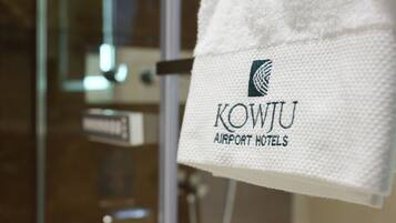 A towel with the logo and name of KOWJU Airport Hotels.