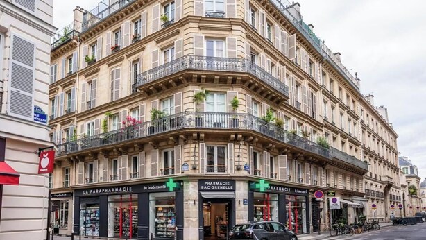 A corner building with multiple pharmacies on the ground floor, including 'La Parapharmacie' and 'Pharmacie Bac Grenelle'. - A SERENE RETREAT & COMBINATION OF LUXURY, COMFORT, AND LOCATION-SAINT GERMAIN (Paris)
