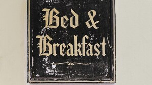 A weathered sign with the words "Bed & Breakfast" in a decorative font. - MyTourist (Heumen)