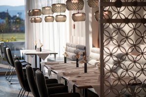 Dinner served, Modern European cuisine, garden views
