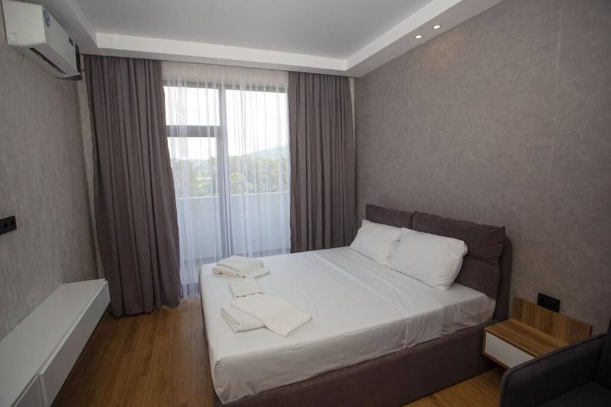 Economy Apartment, Courtyard View | In-room safe, desk, laptop workspace, blackout drapes
