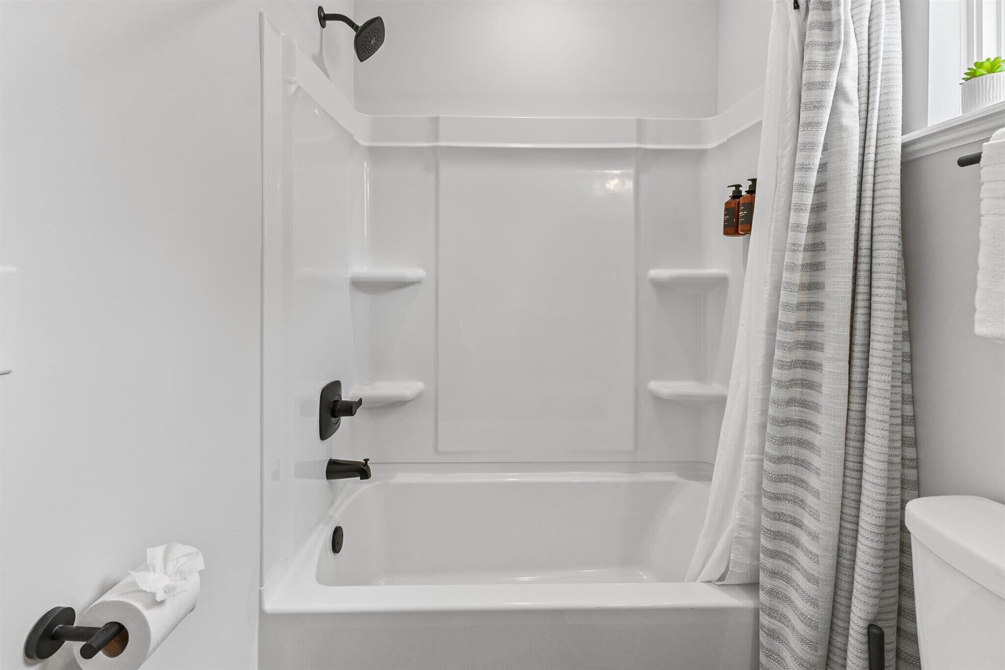 Shower, hair dryer, towels, shampoo
