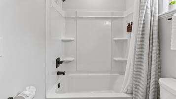 Shower, hair dryer, towels, shampoo