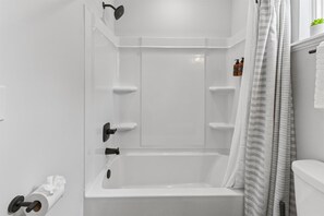 Shower, hair dryer, towels, shampoo