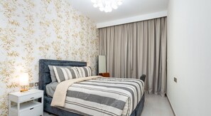 Deluxe Apartment, 1 Bedroom, City View | 1 bedroom, desk, laptop workspace, iron/ironing board