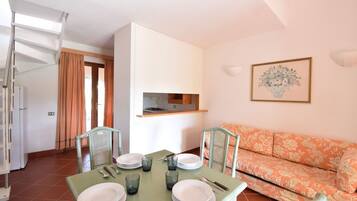 Villa, Sea View | Living area | 32-inch TV with cable channels