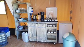 Fridge, stovetop, coffee/tea maker, dining tables