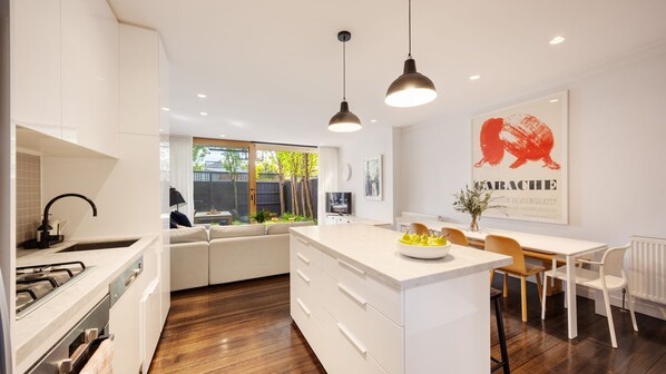 Fridge, stovetop, dishwasher, coffee/tea maker