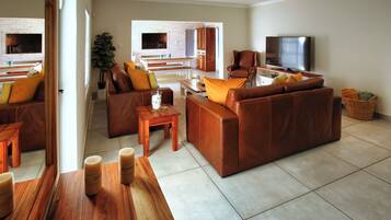 Comfort House, Garden View | Living area | Flat-screen TV