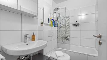 Hair dryer, towels, soap, shampoo