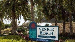 A sign for Venice Beach, Sarasota County Parks & Recreation Department, City Owned - County Operated, located at 101 The Esplanade.