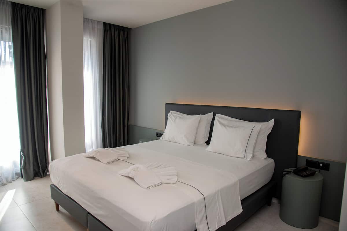Superior Double Room, Balcony, Partial Sea View | In-room safe, soundproofing, iron/ironing board, free cribs/infant beds