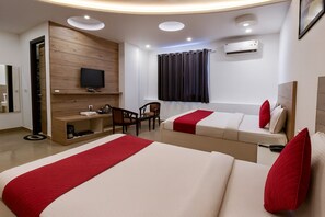 Family Room | Desk, laptop workspace, soundproofing, rollaway beds - Hotel Good Luck by JMD Group (New Delhi)