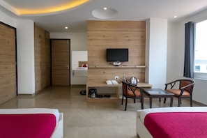 Family Room | Desk, laptop workspace, soundproofing, rollaway beds - Hotel Good Luck by JMD Group (New Delhi)