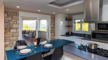 Villa | Private kitchen | Fridge, microwave, oven, stovetop