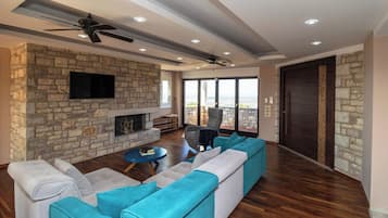 Villa | Living area | TV, fireplace