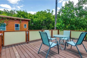 Enjoy al fresco dining on the deck with a round table and four chairs.