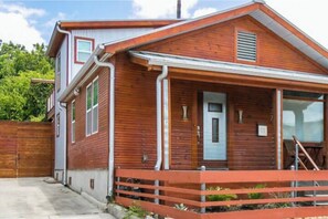 Stunning two-story home with a gabled roof and inviting front porch.