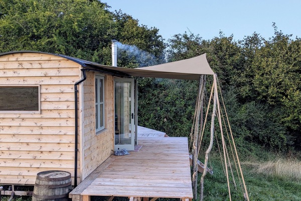 Cwtch Bryn Cabin. Meaning: "Cuddle by the hill".