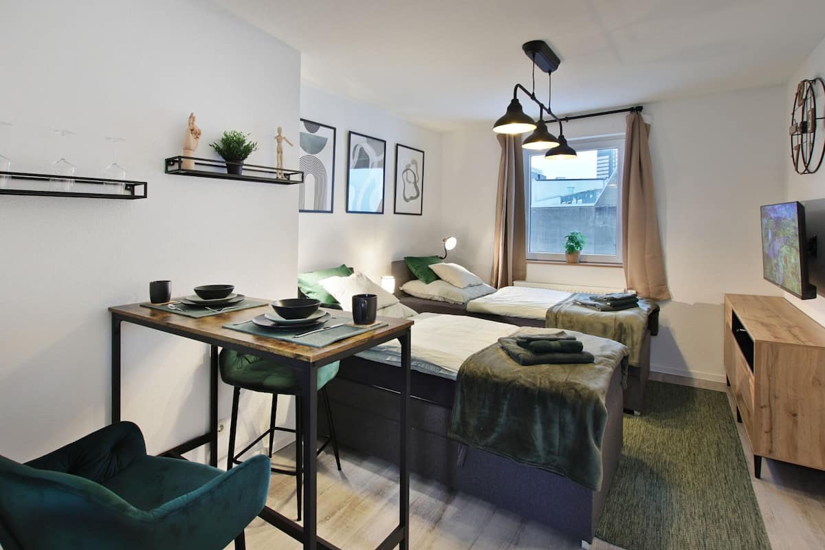 Business Condo, Multiple Beds, Balcony, City View | 1 bedroom, individually decorated, individually furnished