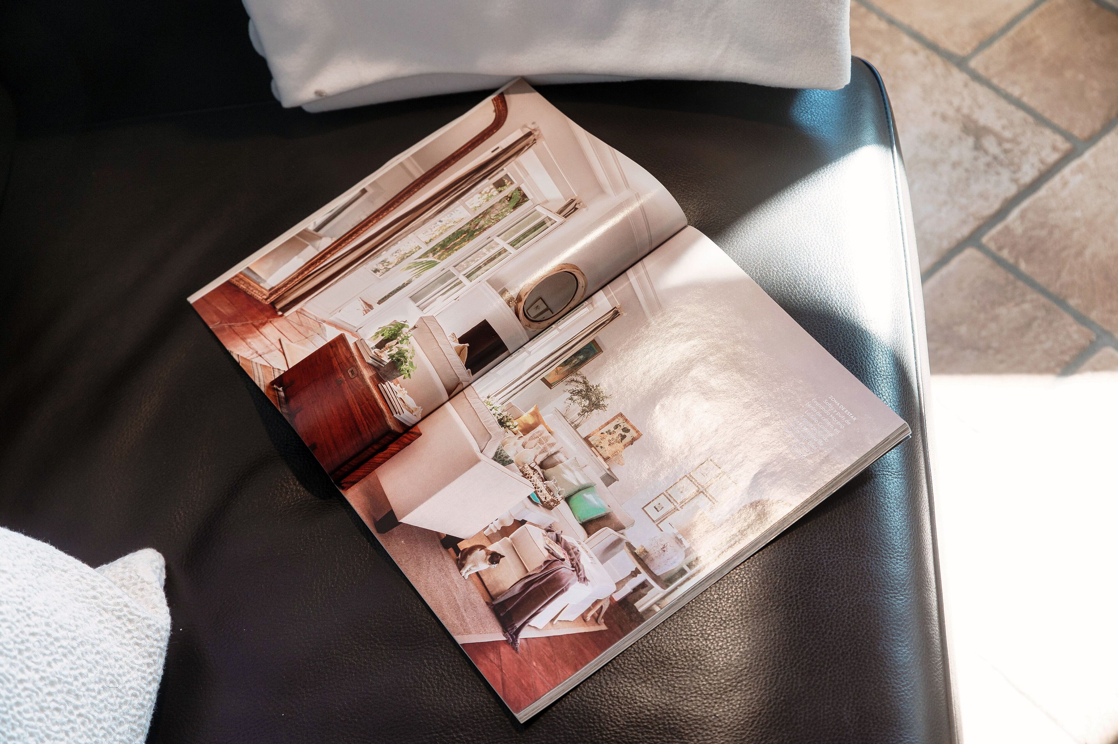 A brochure of a hotel room layout with a bed, bedside table, and a window.