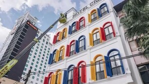 A multi-story hotel with colorful window shutters and a sign reading "HOTEL CIO". - Hotel CIQ, Jalan Trus (Johor Bahru)
